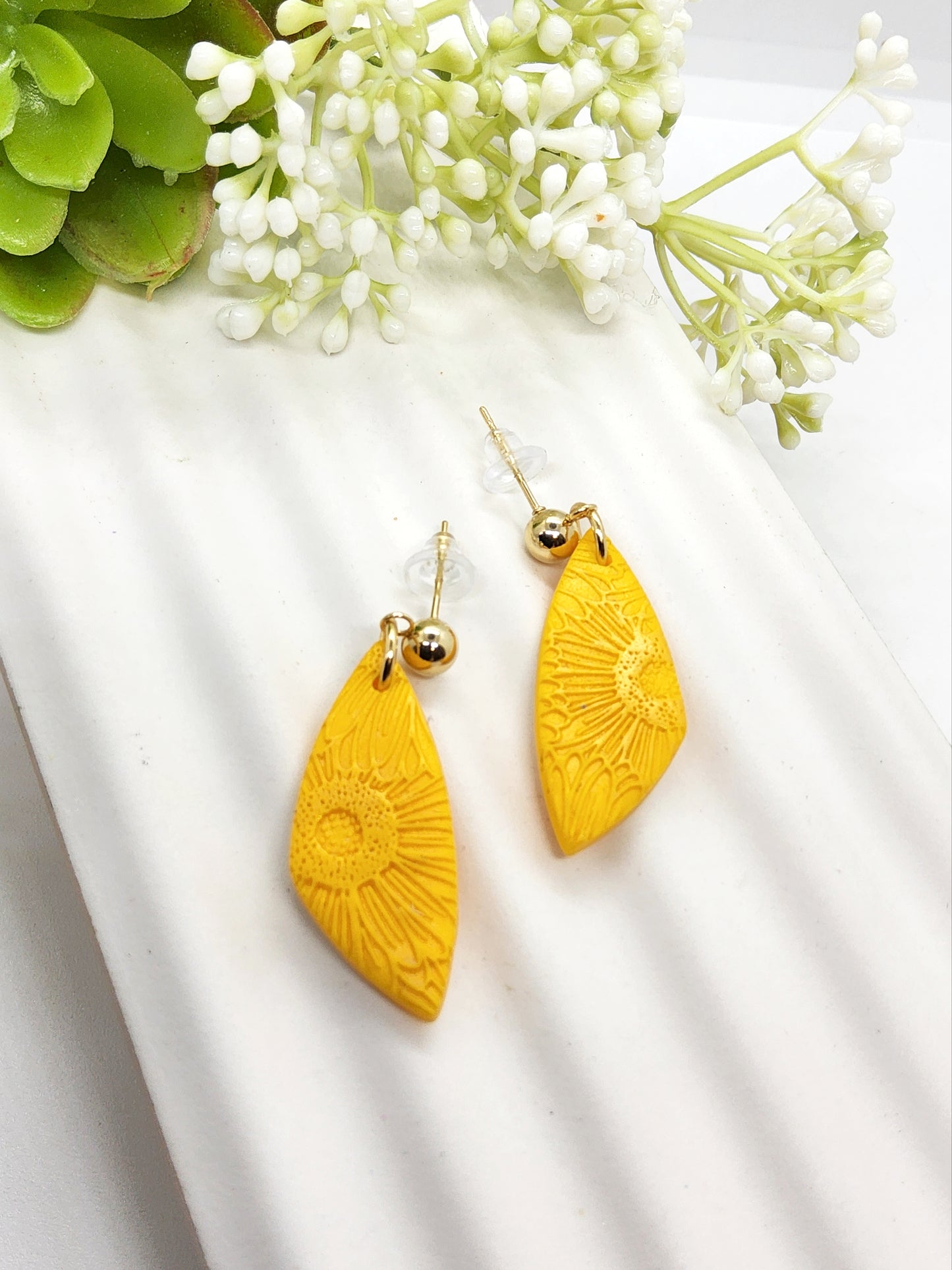 SAFFRON FLOWER EMBOSSED POLYMER CLAY EARRINGS